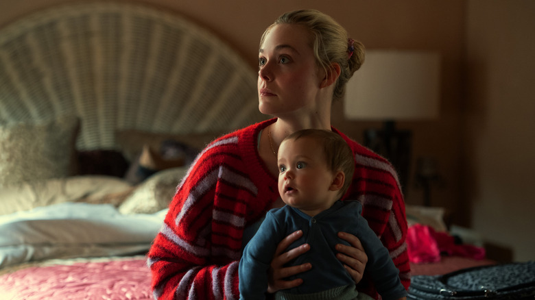 Margo holding Bodhi in Margo's Got Money Troubles
