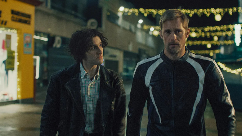 Colin and Ray walking down a street in Pillion