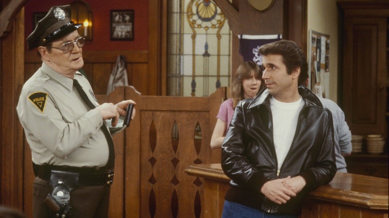 The Fonz getting hassled by the fuzz on Happy Days