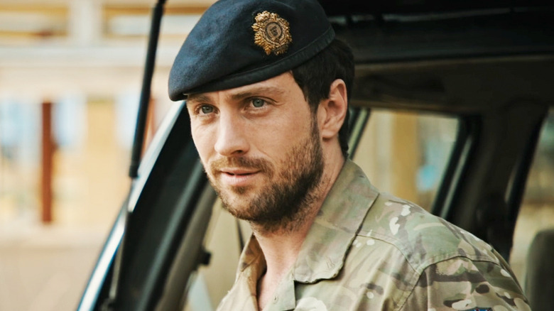 Aaron Taylor-Johnson's Major Will Tranter is seen smiling in closeup in Fuze