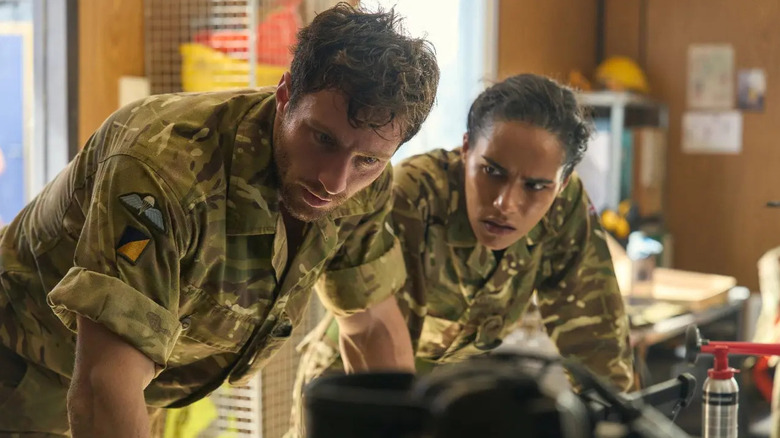 Major Will Tranter and a comrade looking in shock at a phone in Fuze