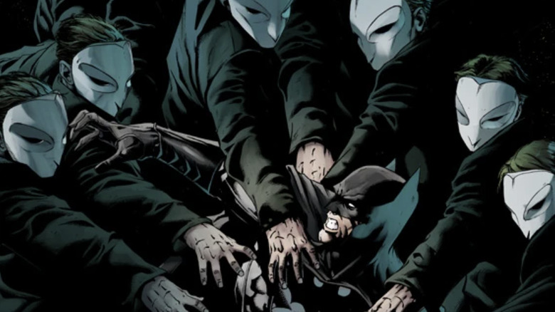 Batman: The Court of Owls cover showing Batman swarmed by Court of Owls