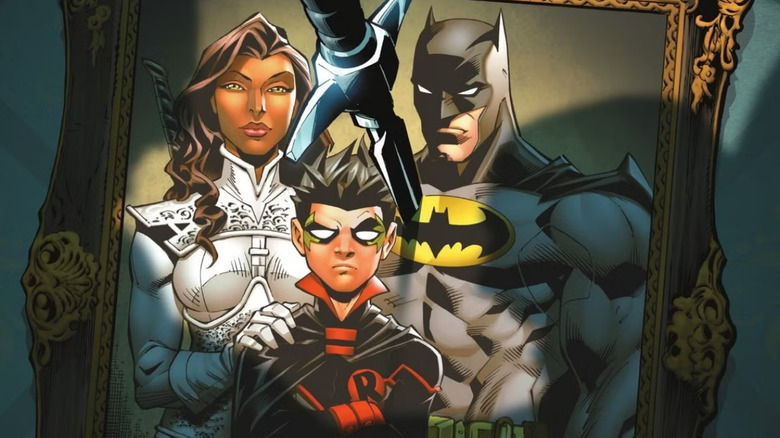 Framed photo of Talia al Ghul, Damian Wayne as Robin, and Batman with knife sticking out of it