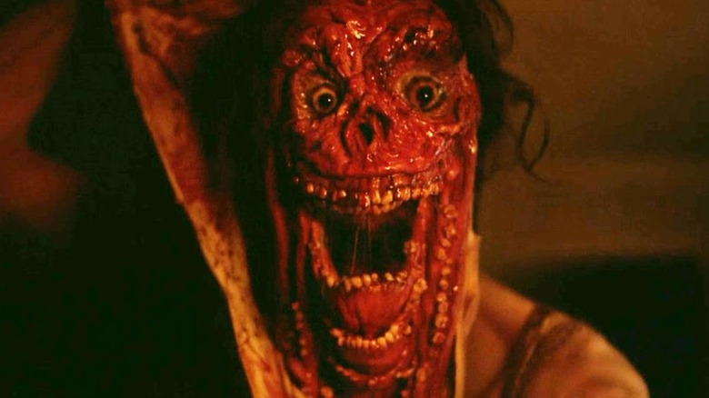 Smile (2022) ending where the Smile Monster peels back its true face