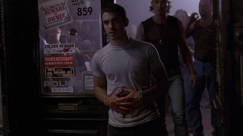 Chris Messina as Tommy clutching stomach wound on Law and Order