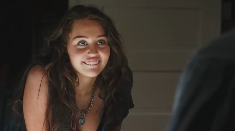 Ronnie (Miley Cyrus) from The Last Song smiles up at her dad