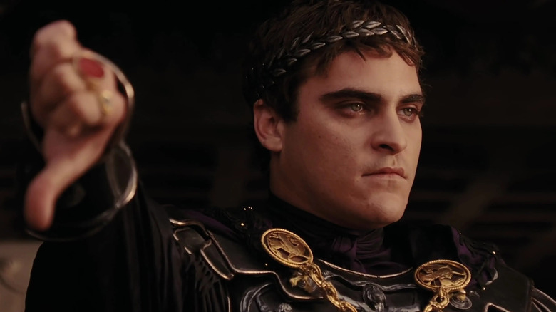 In Gladiator, Commodus (Joaquin Phoenix) holds a thumbs-down out to to the crowd
