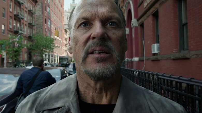 Riggan (Michael Keaton) from Birdman in closeup, dissociating while he walks down a New York City sidewalk