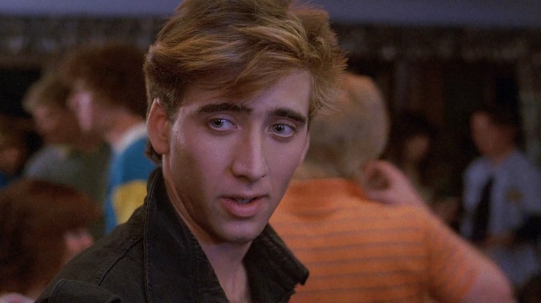 Randy (Nicolas Cage) smirks across a party in Valley Girl