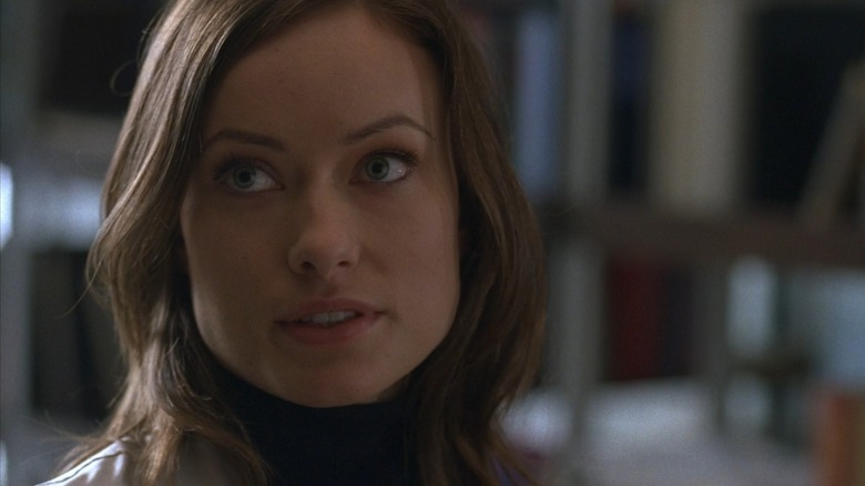 Thirteen (Olivia Wilde) from House M.D. giving a diagnosis in her lab coat
