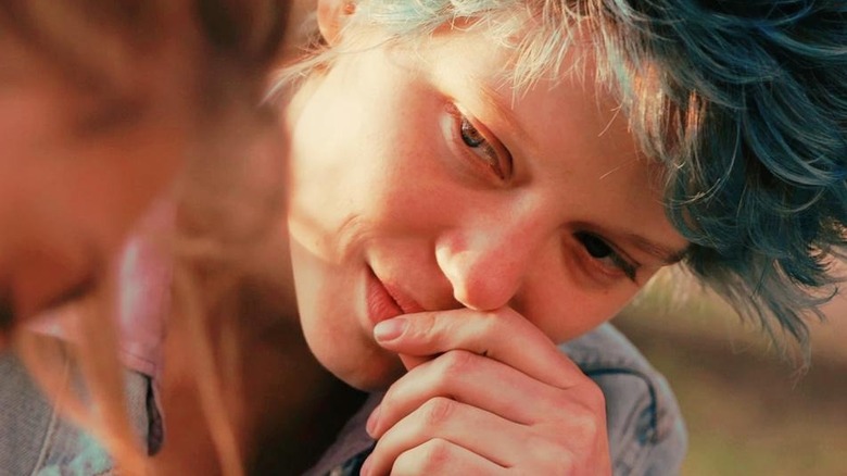 Léa Seydoux as Emma with blue hair smiling in Blue is the Warmest Colour