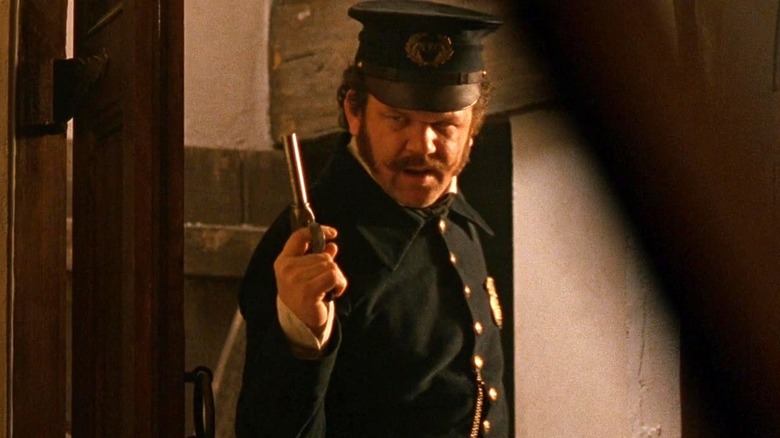 Happy Jack Mulraney holding gun