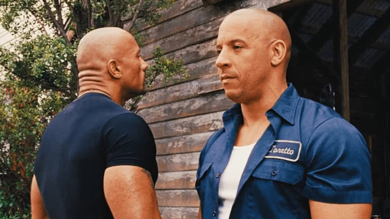 Vin Diesel as Dominic Toretto and Dwayne Johnson as Luke Hobbs in Fast & Furious 6, standing side by side