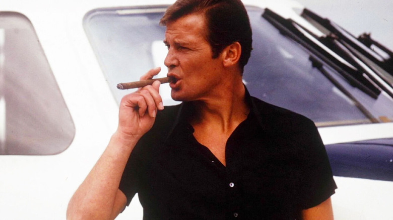 Roger Moore as James Bond in The Spy Who Loved Me, smoking a cigar