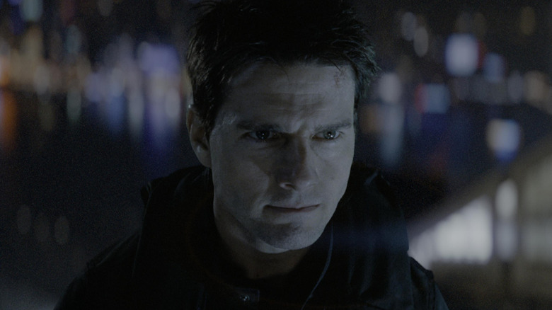 Tom Cruise as Ethan Hunt in Mission: Impossible III, looking intently at something off in the distance