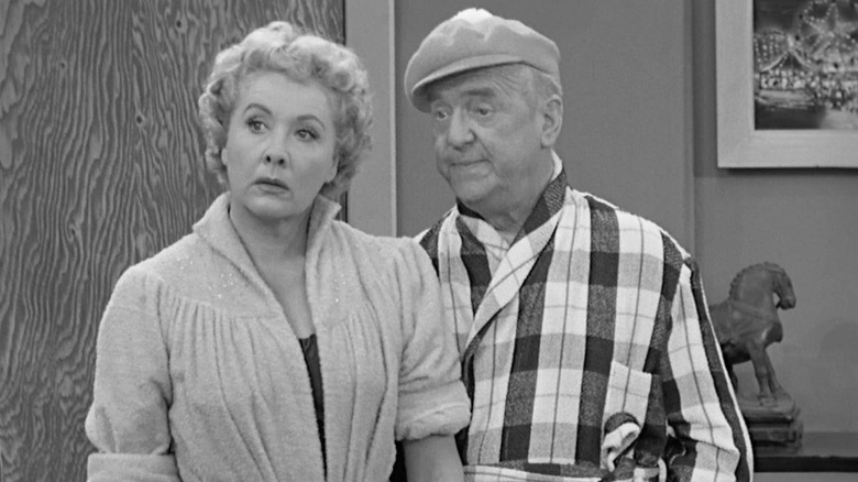 Vivian Vance as Ethel Mertz and William Frawley as Fred Mertz, standing next to each other looking out of frame in I Love Lucy