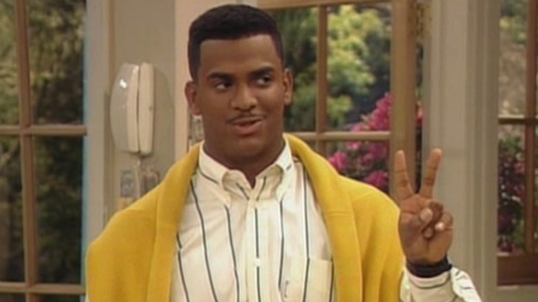 Carlton Banks holding up a peace sign