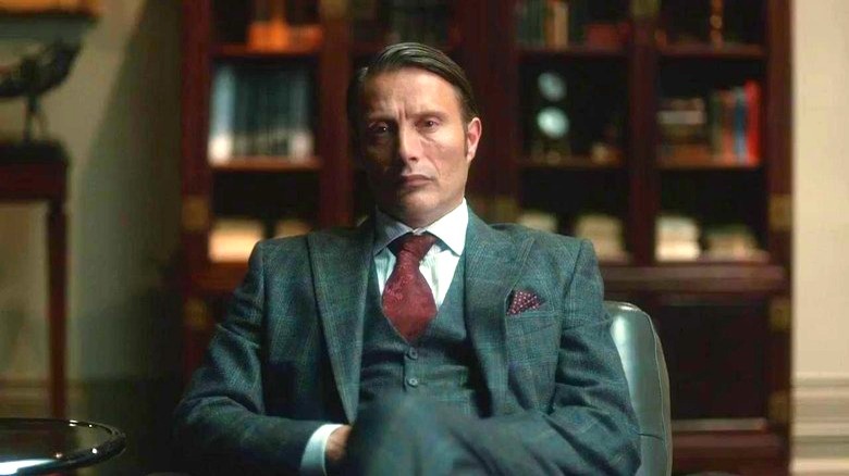 Hannibal Lecter sitting in nice suit