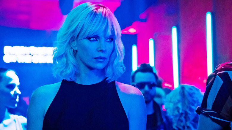 Lorraine Broughton in a neon colored night club in Atomic Blonde