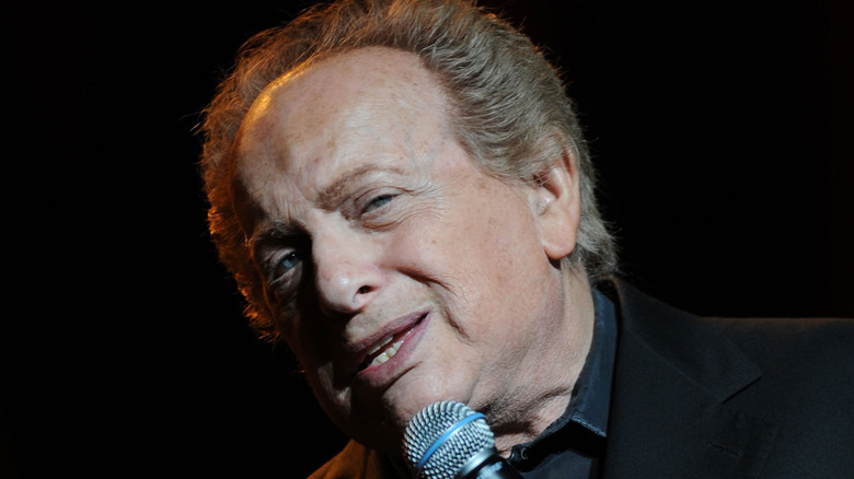 Jackie Mason smirking during a show