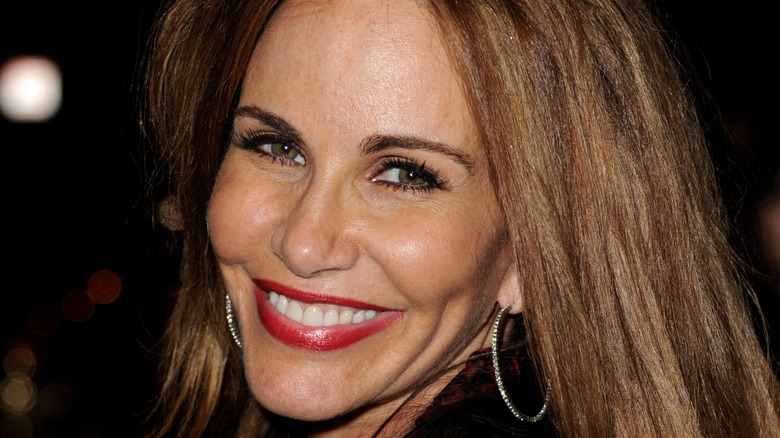 Tawny Kitaen smiling at a movie premiere