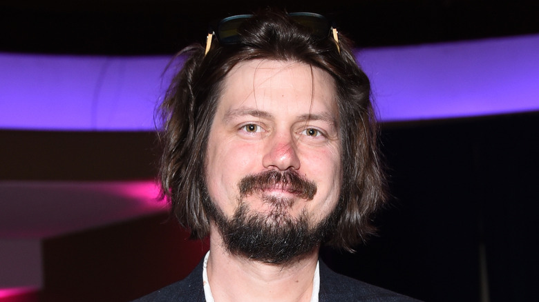 Trevor smiling at a 2018 premiere
