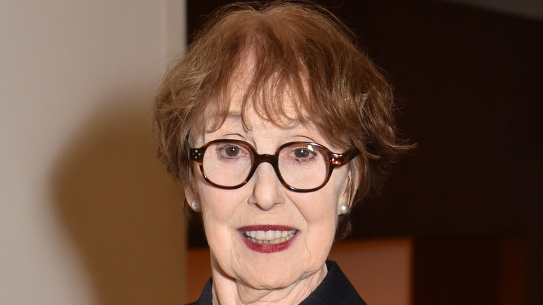 Una Stubbs smiling for the camera