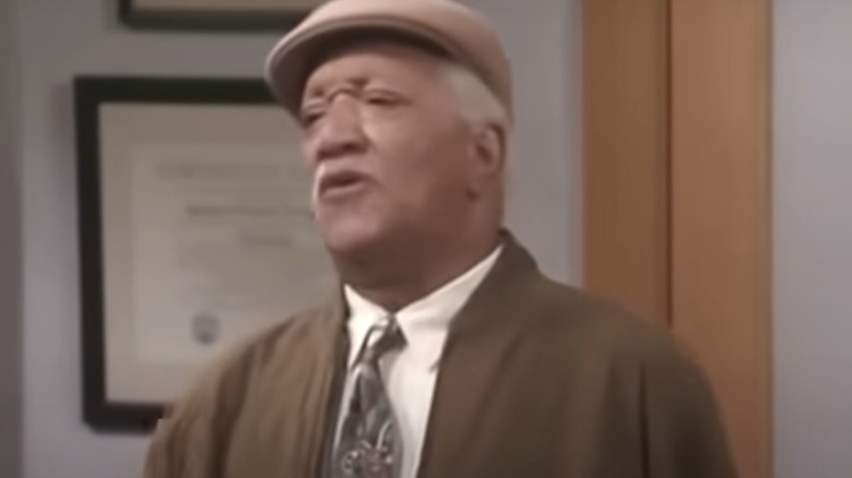 Al Royal (Redd Foxx) talks to the principal on The Royal Family