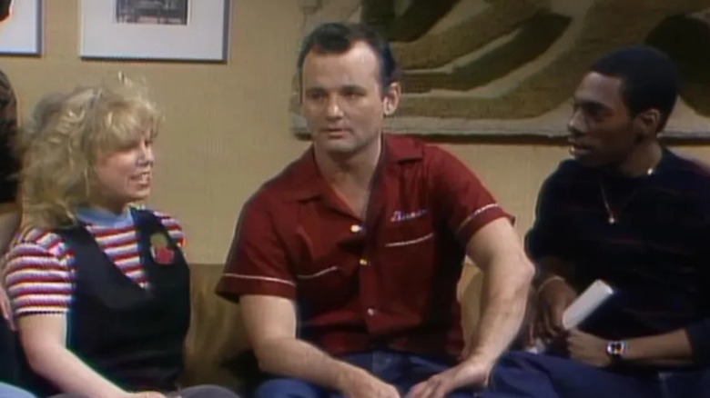 Bill Murray sitting in between Eddie Murphy and Ann Risley on Saturday Night Live.