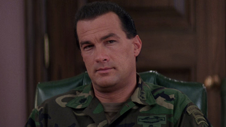 Steven Seagal as Lieutenant Colonel Austin Travis looking on at someone out of frame in Executive Decision.