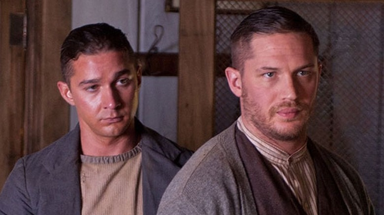 Shia LaBeouf as Jack Bondurant and Tom Hardy as Forrest Bondurant looking serious in Lawless.