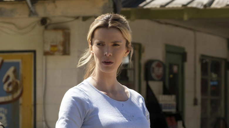 Betty Gilpin standing outside as Crystal in The Hunt