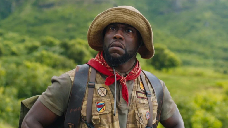 Kevin Hart as Mouse stands in the wilderness in Jumanji: Welcome to the Jungle