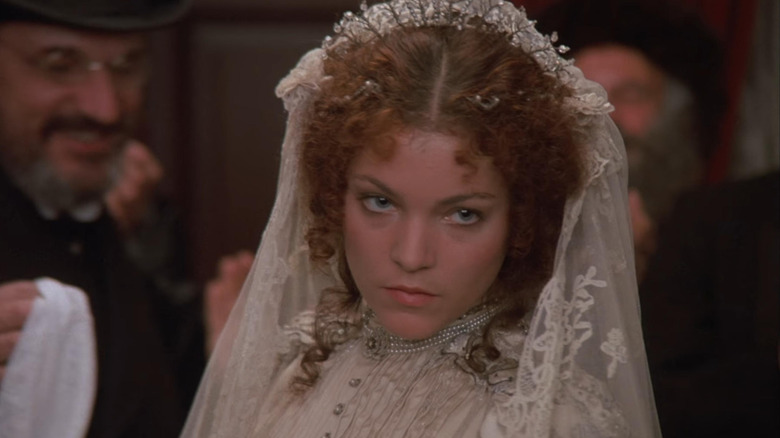 Hadass looking over her shoulder scornfully in a wedding dress in Yentl