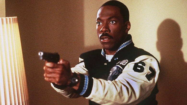 Eddie Murphy pointing gun