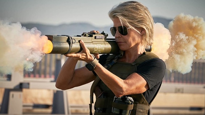 Linda Hamilton rocket launcher vest rain Terminator: Dark Fate