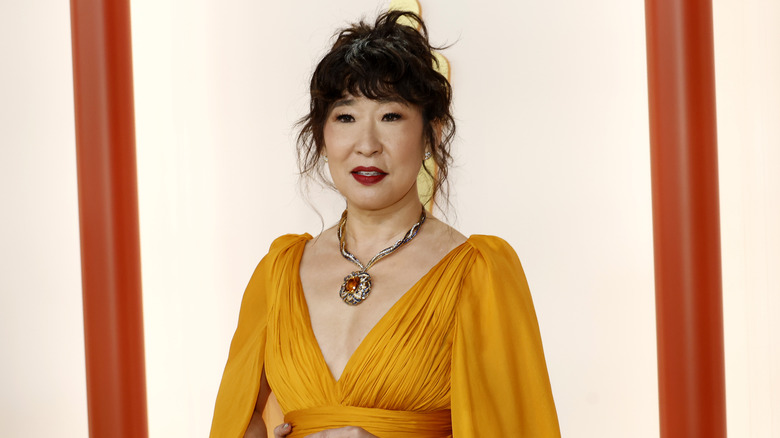 Sandra Oh wearing orange dress