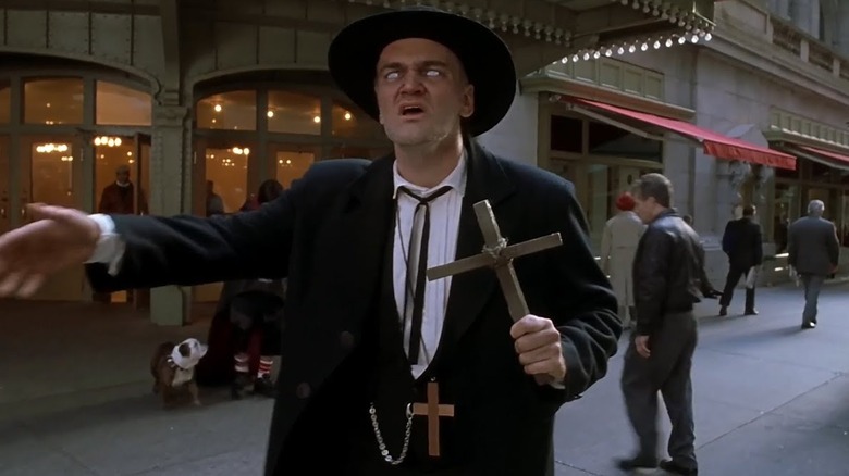 Quentin Tarantino as Deacon preaching on the street in Little Nicky