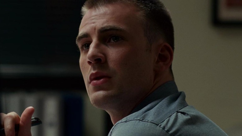 Detective Paul Diskant looking up in concern from his desk in Street Kings