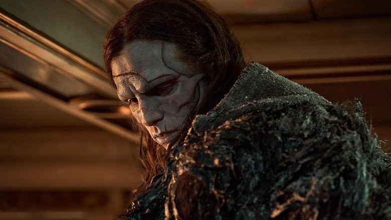 The Creature (Jacob Elordi) staring at the floor in Frankenstein (2025)