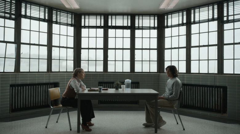 Tom Holland's Danny Sullivan sits opposite Amanda Seyfried's Rya Goodman in an interrogation room in The Crowded Room