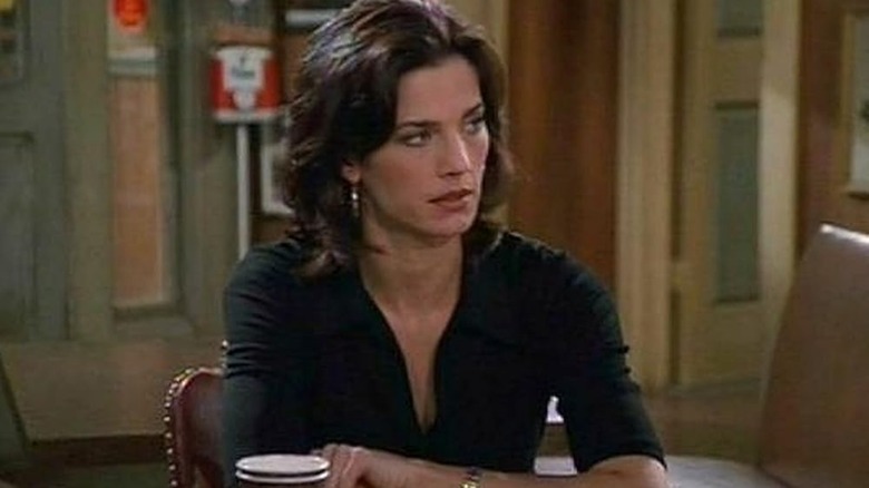 Reggie leaning on a table in Becker