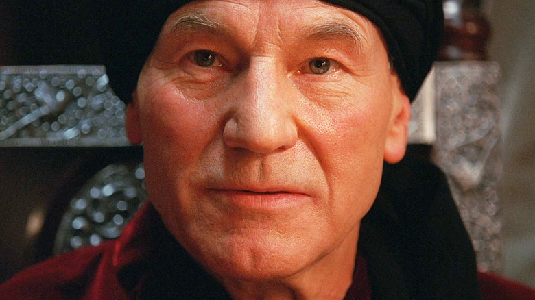 Patrick Stewart's Captain Nemo is seen in closeup as he sits at a table in Mysterious Island