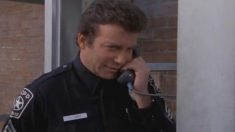 Sergeant Thomas Jefferson Hooker (William Shatner) talks on a payphone during T.J. Hooker