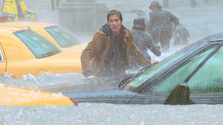 Sam surrounded by cars and waist-high icy water in The Day After Tomorrow