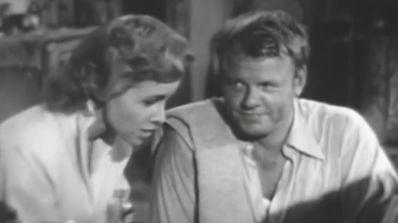 Louise and Biff looking at something together in Biff Baker, U.S.A.