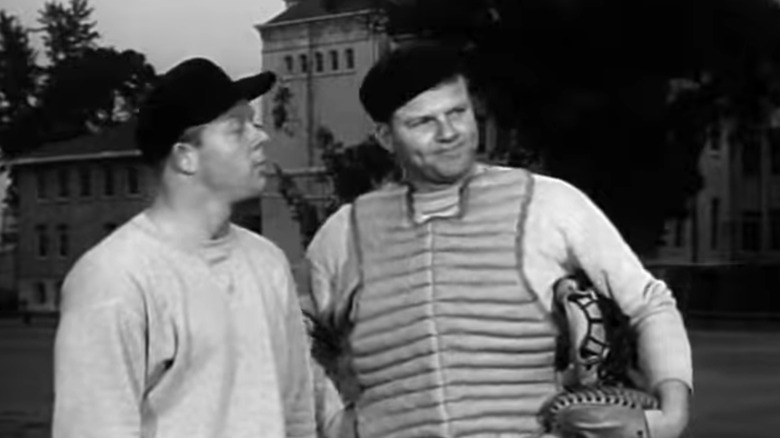 Alan Hale Jr's Schmidt stands next to Bill Murphy's Isabell in It Happens Every Spring