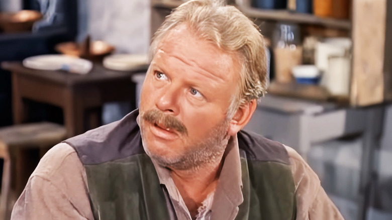 Alan Hale Jr.'s Swede Lundberg looks surprised as he sits at a table in Bonanza