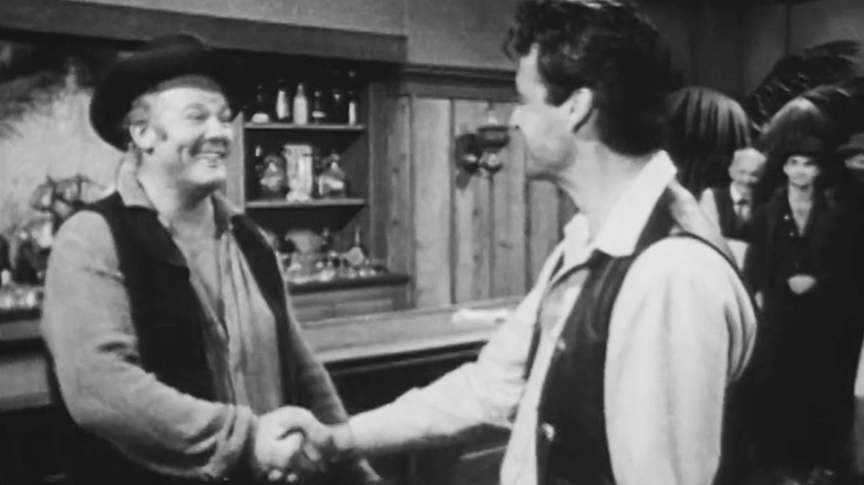 Alan Hale Jr's Jake Bricker shakes the hand of Rory Calhoun's Bill Longley in The Texan