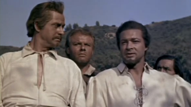 Anthony Dexter's Captain John Smith stands with his setllers including Alan Hale Jr's Fleming in Captain John Smith and Pocahontas